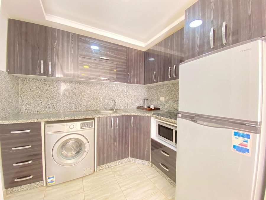 Penthouse v Aqua Palms — kuchyně s pračkou